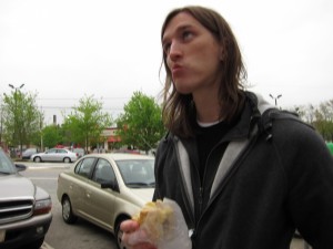 Jeff eating a sausage biscuit