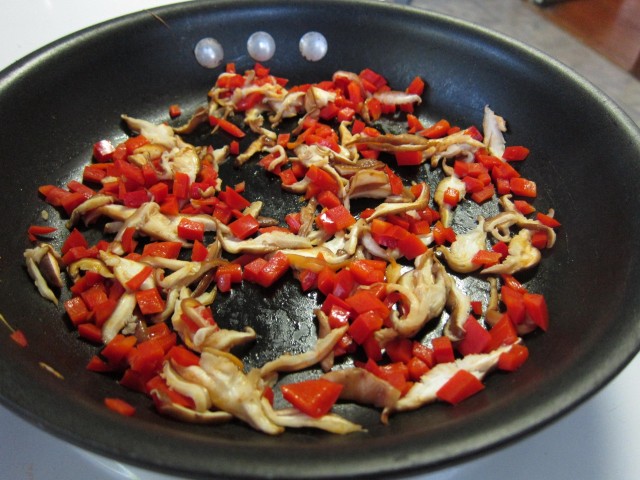 Saute peppers and shiitakes